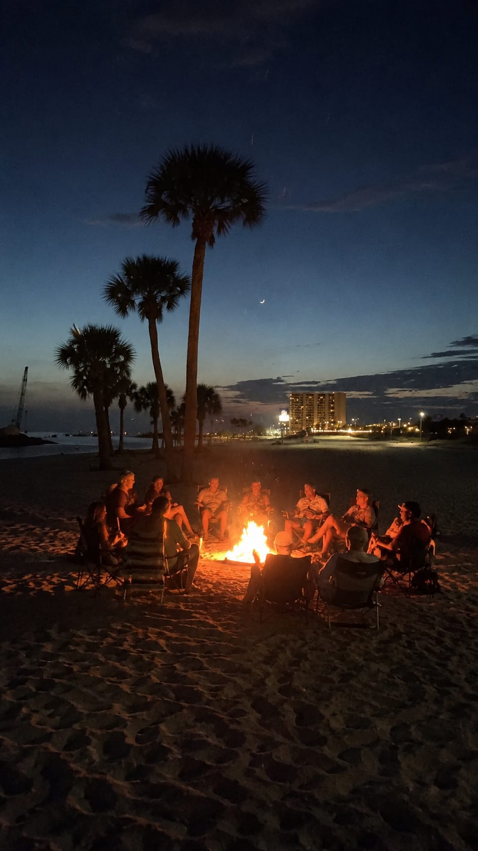 Twilight bonfire under the palms on the Mississippi Gulf Coast